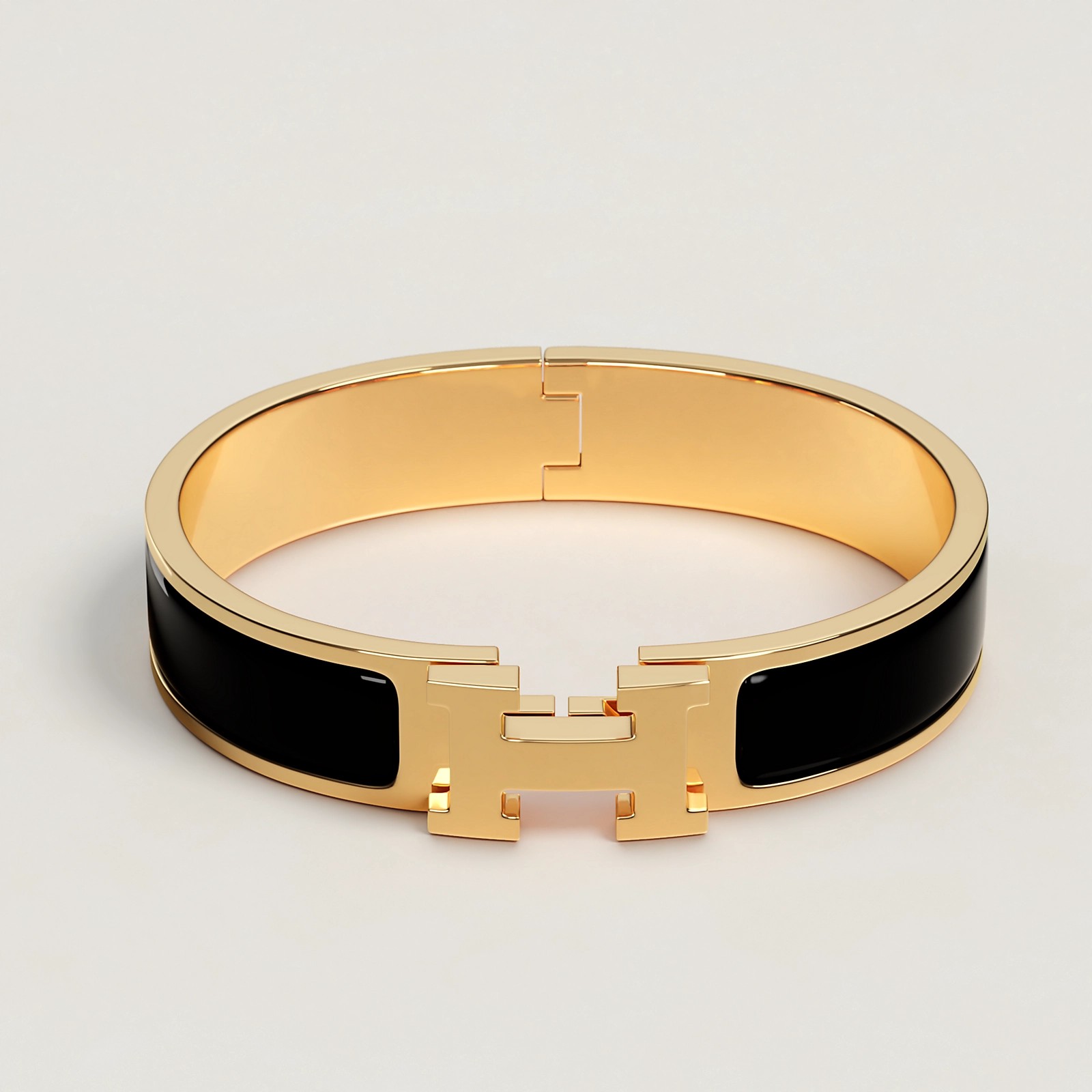 BRACELET HERMES CLIC H NOIR DOREE